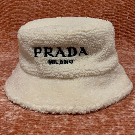 cream prada bucket hat|used prada bucket hat.